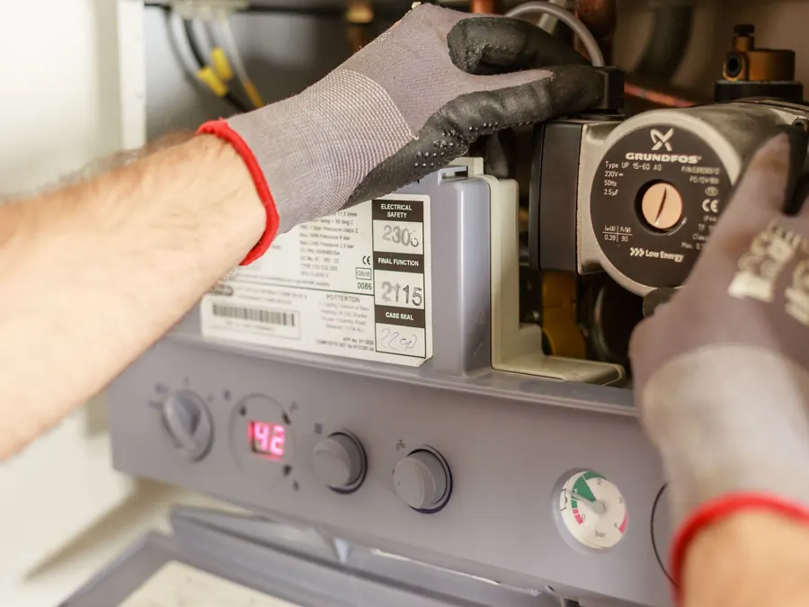 Technician working on a home heating system